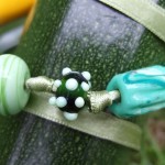 “Green Harvest” five beads on ribbon