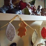 autumn leaf garland hanging from shelf