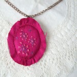 cerise silk hand embroidered pendant