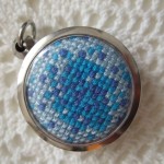 cross stitch round pendant - blue
